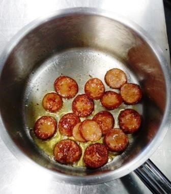 Fry the sausage until coloured